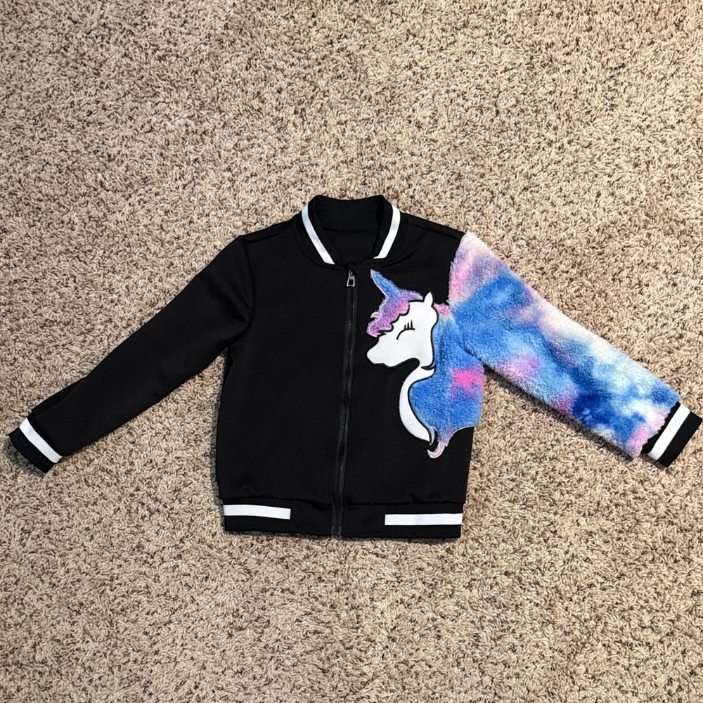 Girls size 130 (6/7) black jacket with unicorn and furry sleeve on one side